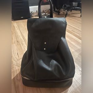 Black leather backpack, with separate shoe space! Great overnight bag.